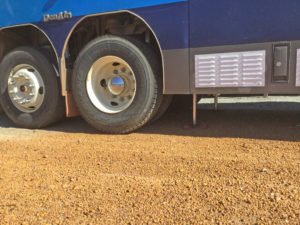 Redfoot Levelling - A blue truck parked on a dirt road.