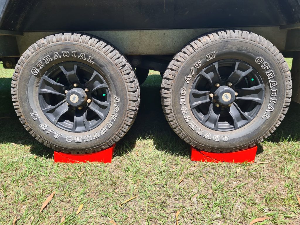 Redfoot Levelling - A truck with two Redfoot Levelling Camper Levellers on the ground.