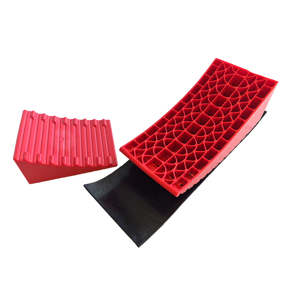 Redfoot Levelling - A pair of red and black plastic ramps on a white surface.