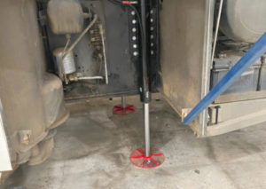 Redfoot Levelling - A Medium/Heavy Ridged Vehicles with a jack attached to it.