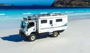 Redfoot Levelling - An Expedition Off-Road Vehicles parked on a white sandy beach.